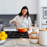 woman cooking inside kitchen room